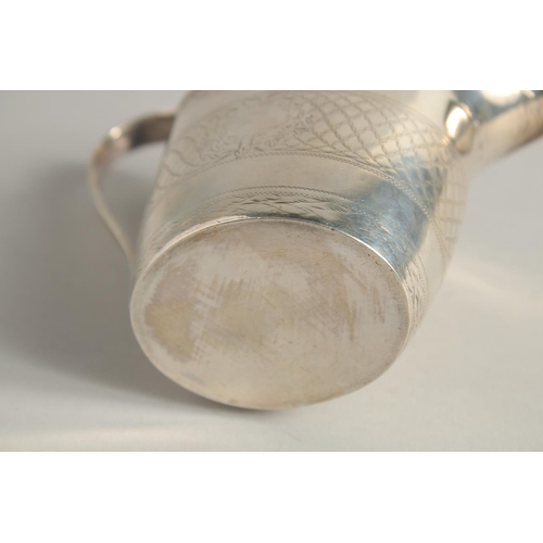 1881 - A GEORGE III SILVER CREAM JUG with reeded edge and engraved body. London 1795.