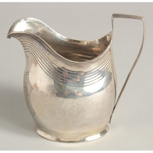 1882 - A GEORGE III SILVER CREAM JUG with reeded edge and engraved crest. London 1801 maker A & G  BURROWS.... 