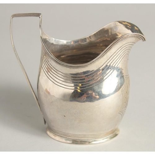 1882 - A GEORGE III SILVER CREAM JUG with reeded edge and engraved crest. London 1801 maker A & G  BURROWS.... 