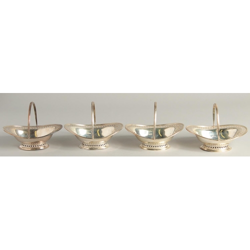 1888 - A SET OF FOUR SMALL SILVER OVAL PIERCED BASKETS with swing handles. Sheffield 1893, maker Atkin Bros... 