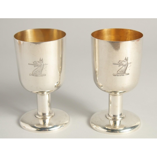 1892 - AN EXCELLENT PAIR OF SILVER GOBLETS BY R. J. J. with gilt interior.  Griffin crest. 4.75ins high, we... 