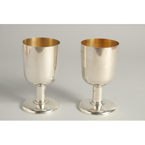 1892 - AN EXCELLENT PAIR OF SILVER GOBLETS BY R. J. J. with gilt interior.  Griffin crest. 4.75ins high, we... 