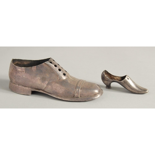 1896 - A LARGE SILVER SHOE, 4.75ins long, Birmingham 1903, and another, 2.5ins long.  Birmingham 1938 (2).