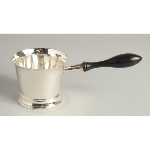 1898 - A GEORGE III SILVER BRANDY PAN with turned wood handle. 3.75ins diameter.  London 1804. Maker Peter ... 