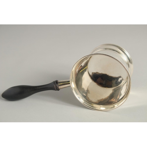 1898 - A GEORGE III SILVER BRANDY PAN with turned wood handle. 3.75ins diameter.  London 1804. Maker Peter ... 