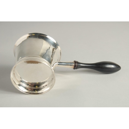 1898 - A GEORGE III SILVER BRANDY PAN with turned wood handle. 3.75ins diameter.  London 1804. Maker Peter ... 