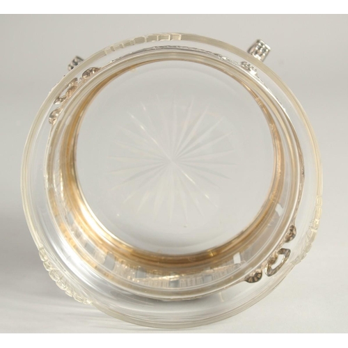 1919 - A CONTINTENTAL .800 SILVER AND GLASS CIRCULAR FRUIT BOWL of Adam design supported on four claw feet.... 