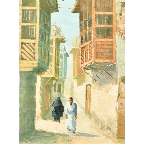 369 - 20th Century, a study of Arab figures walking in a narrow city street, oil on canvas, 25