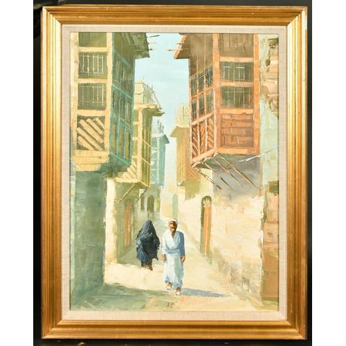 369 - 20th Century, a study of Arab figures walking in a narrow city street, oil on canvas, 25