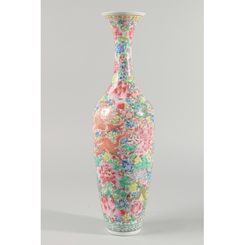 10 - A TALL CHINESE FAMILLE ROSE EGGSHELL PORCELAIN VASE, decorated with flowers and dragons, 50.5cm high... 