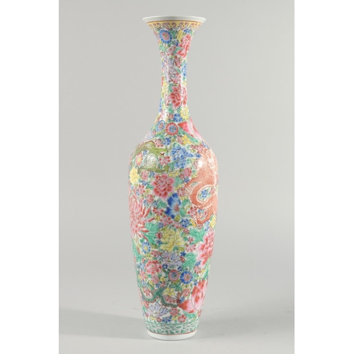 10 - A TALL CHINESE FAMILLE ROSE EGGSHELL PORCELAIN VASE, decorated with flowers and dragons, 50.5cm high... 