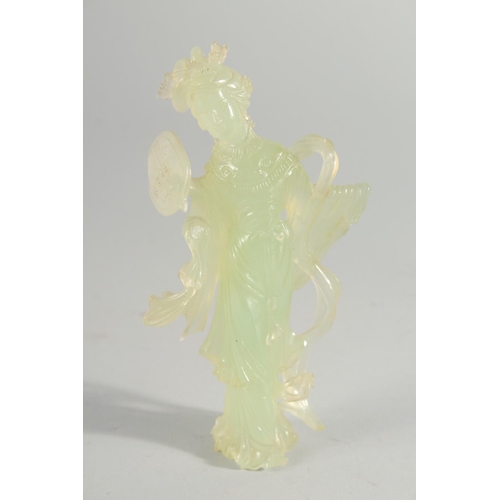 18 - A LARGE CHINESE CARVED HARDSTONE PUZZLE BALL, 12cm high, together with a carved jade figure of a gei... 