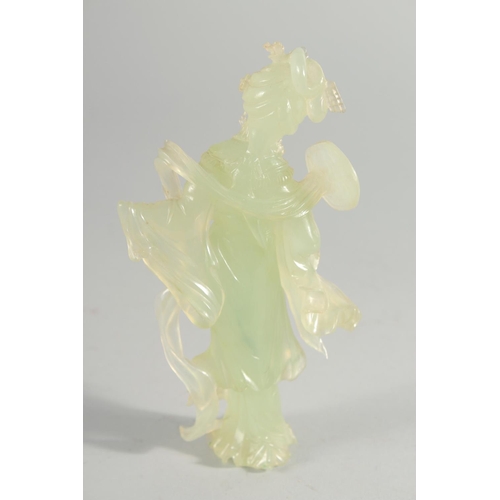 18 - A LARGE CHINESE CARVED HARDSTONE PUZZLE BALL, 12cm high, together with a carved jade figure of a gei... 