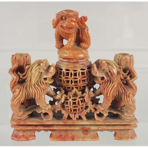 20 - TWO CHINESE SOAPSTONE CARVINGS, one carved with foo dogs, the other of immortals on a soapstone base... 