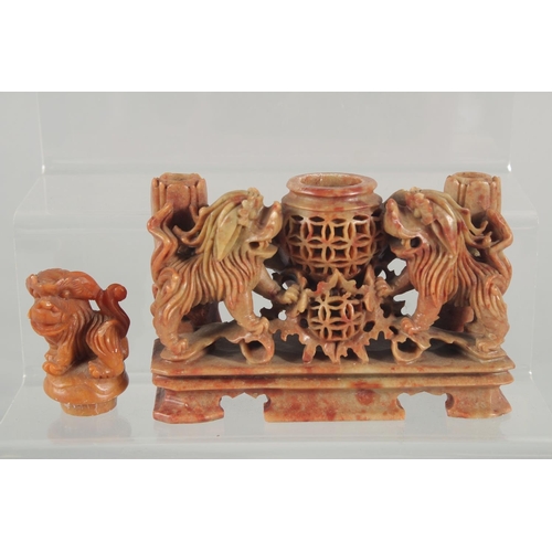 20 - TWO CHINESE SOAPSTONE CARVINGS, one carved with foo dogs, the other of immortals on a soapstone base... 