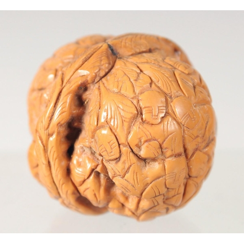 28 - THREE WOODEN CARVINGS, together with two walnut carvings, (5).