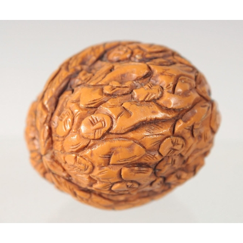 28 - THREE WOODEN CARVINGS, together with two walnut carvings, (5).