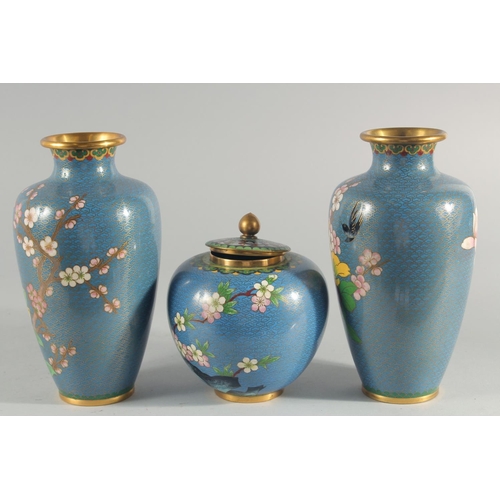 3 - TWO CHINESE BLUE GROUND CLOISONNE VASES, and a similar jar with associated cover, vases 23.5cm high,... 