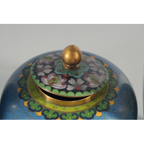 3 - TWO CHINESE BLUE GROUND CLOISONNE VASES, and a similar jar with associated cover, vases 23.5cm high,... 