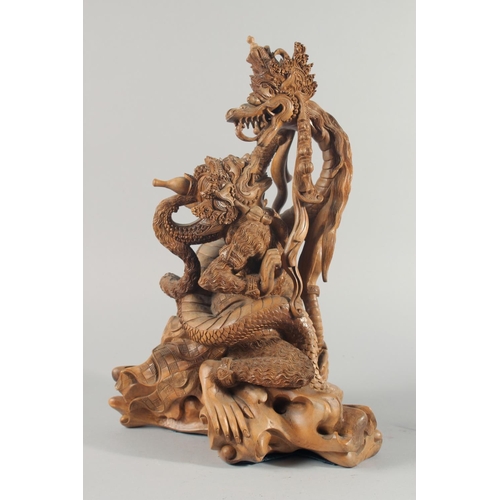 30 - A GOOD QUALITY LARGE THAI CARVED WOOD FIGURAL GROUP, 48cm high.