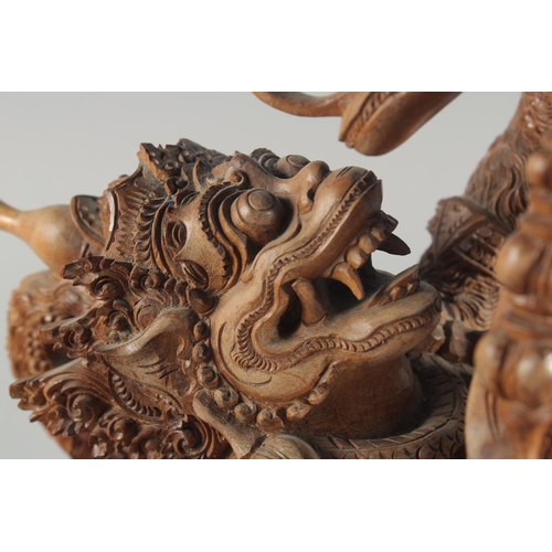 30 - A GOOD QUALITY LARGE THAI CARVED WOOD FIGURAL GROUP, 48cm high.