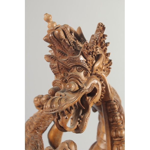 30 - A GOOD QUALITY LARGE THAI CARVED WOOD FIGURAL GROUP, 48cm high.