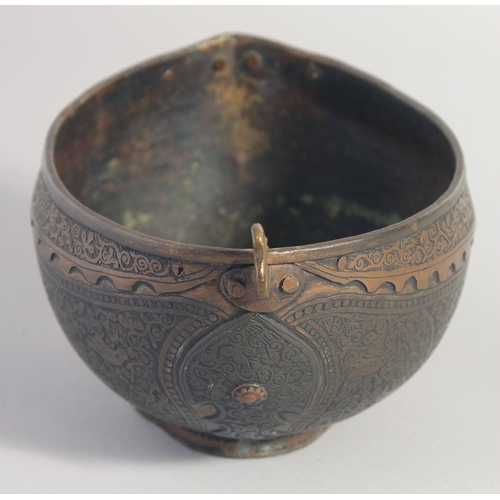 35 - AN ISLAMIC ENGRAVED BRASS KASHKOOL, 20.5cm wide.