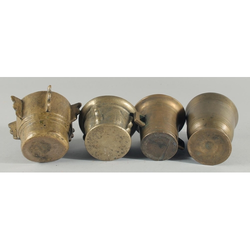 37 - A COLLECTION OF FOUR BRONZE PESTLE AND MORTARS, (eight pieces).