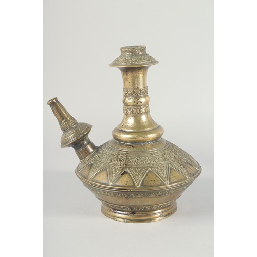 38 - A PAIR OF EARLY ISLAMIC BRASS HUQQA BASES, with bands of foliate decoration, 25cm high.