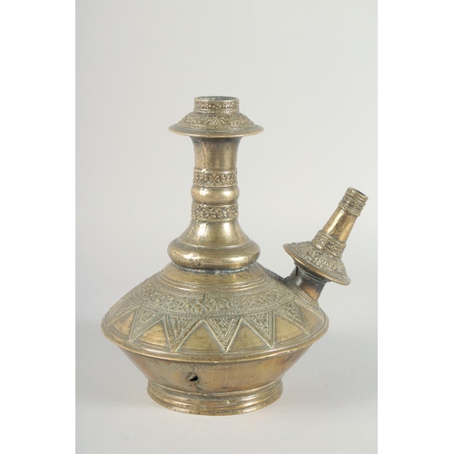 38 - A PAIR OF EARLY ISLAMIC BRASS HUQQA BASES, with bands of foliate decoration, 25cm high.