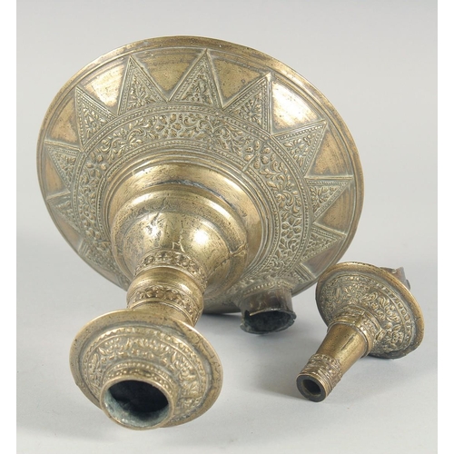 38 - A PAIR OF EARLY ISLAMIC BRASS HUQQA BASES, with bands of foliate decoration, 25cm high.
