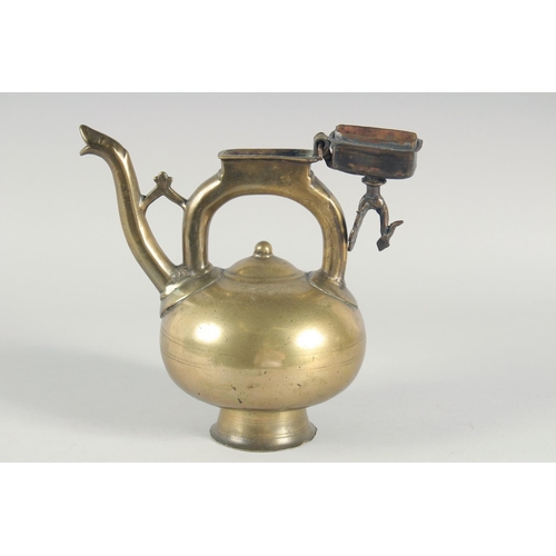 39 - AN ISLAMIC BRONZE EWER, the handle with peacock finial, inscribed, 31cm high.