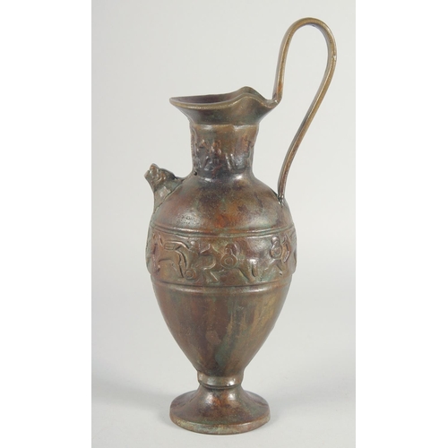 41 - AN EARLY CLASSICAL BRONZE EWER, with a band of archaic style figures to the body, 35cm high.