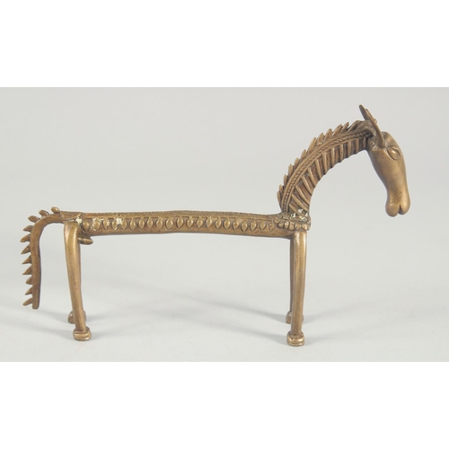 42 - AN ISLAMIC BRASS FIGURE OF A STYLISED HORSE, 24.5cm long.