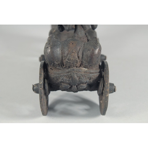 43 - A BURMESE BRONZE MODEL OF A CART, with two figures being pulled by horses, 25.5cm long.