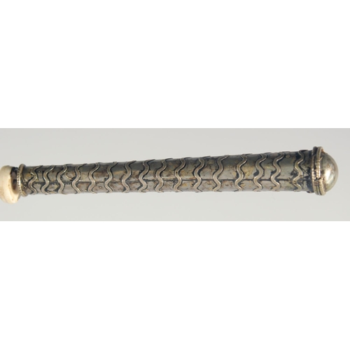 45 - A TIBETAN PRAYER WHEEL, with inscribed scroll inside, 21.5cm long.