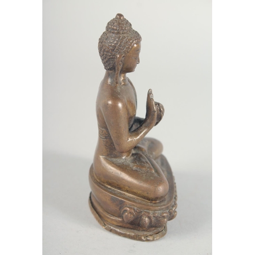 54 - A BRONZE FIGURE OF A SEATED BUDDHA, 14cm high.