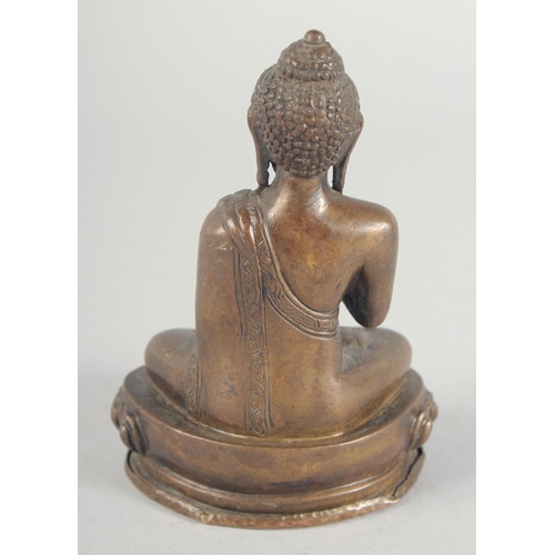 54 - A BRONZE FIGURE OF A SEATED BUDDHA, 14cm high.