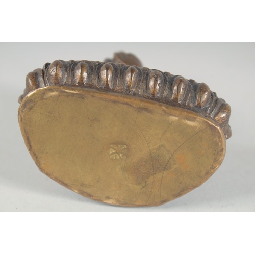 54 - A BRONZE FIGURE OF A SEATED BUDDHA, 14cm high.