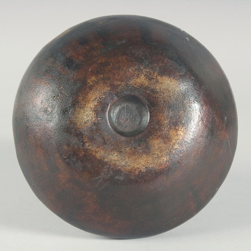 55 - AN EARLY BRONZE CIRCULAR VASE, with chased decoration of a band of various animals, 21cm high.