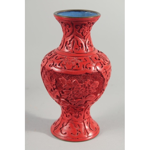 9 - A PAIR OF CHINESE CINNABAR LACQUER VASES, decorated with landscape scenes, together with two similar... 