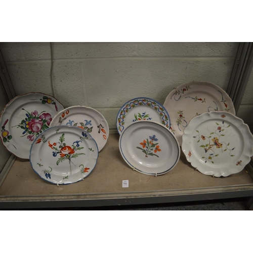 556 - A group of Continental floral decorated plates and dishes.