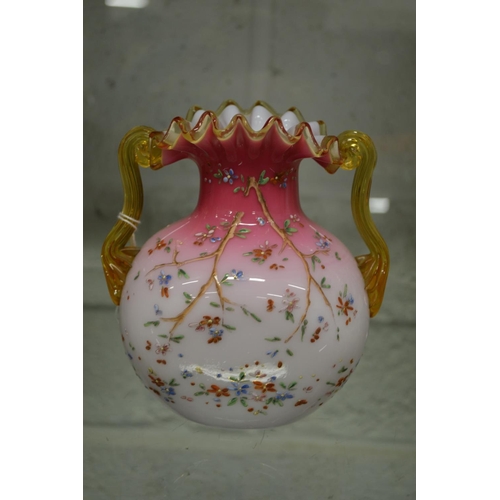 559 - A good opaque glass frilly edged twin handled vase with enamel decoration.