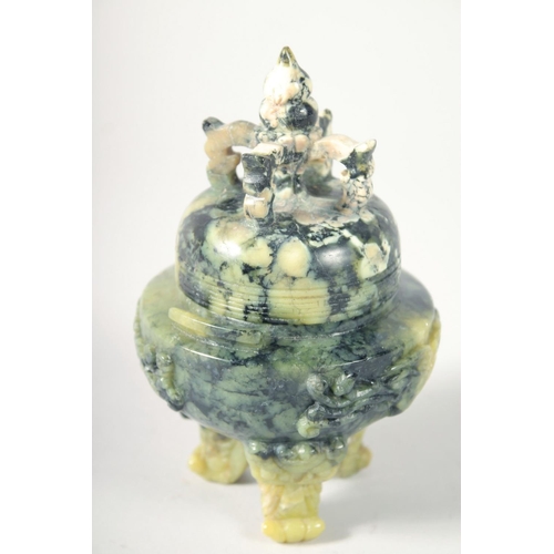 249 - A CHINESE MARBLED GREEN SOAPSTONE TRIPOD LIDDED CENSER, 17cm high.