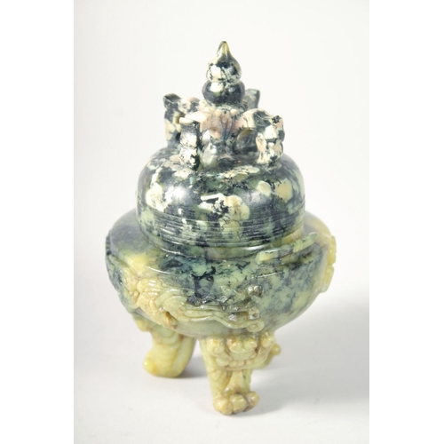 249 - A CHINESE MARBLED GREEN SOAPSTONE TRIPOD LIDDED CENSER, 17cm high.