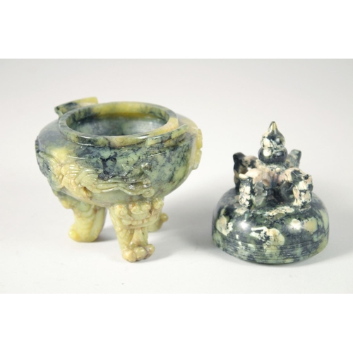 249 - A CHINESE MARBLED GREEN SOAPSTONE TRIPOD LIDDED CENSER, 17cm high.