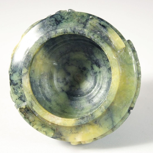 249 - A CHINESE MARBLED GREEN SOAPSTONE TRIPOD LIDDED CENSER, 17cm high.