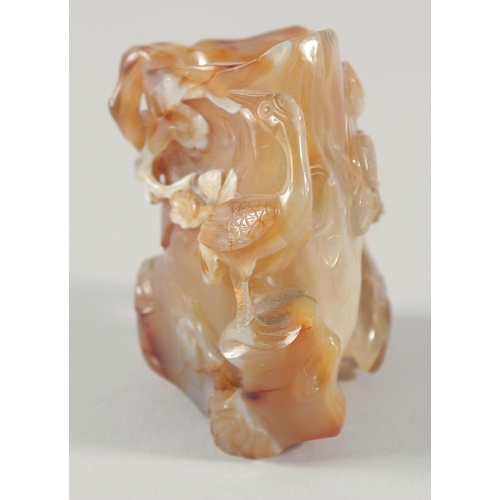 251 - A CHINESE CARVED AGATE BRUSH WASH, the body beautifully relief-carved with animals, branches and flo... 