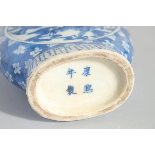 135 - A CHINESE BLUE AND WHITE PORCELAIN MOONFLASK, with moulded handles and painted with dragon and phoen... 