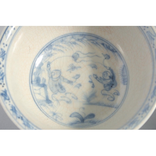 137 - A NEAR PAIR OF CHINESE BLUE AND WHITE PORCELAIN BOWLS, 14cm diameter.